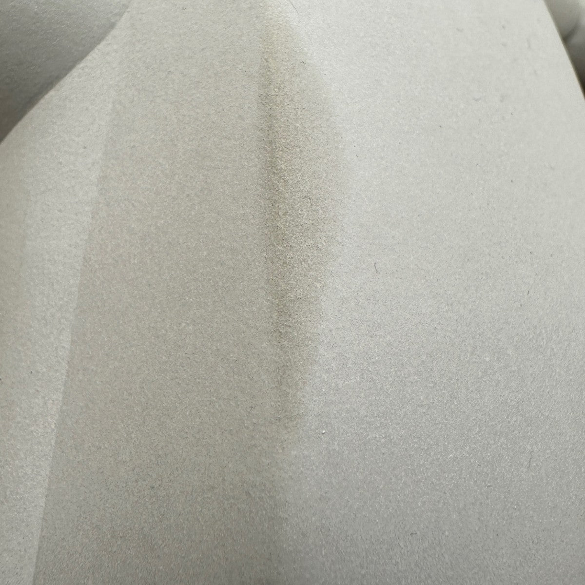 Uneven texture and surface variation across raw concrete
